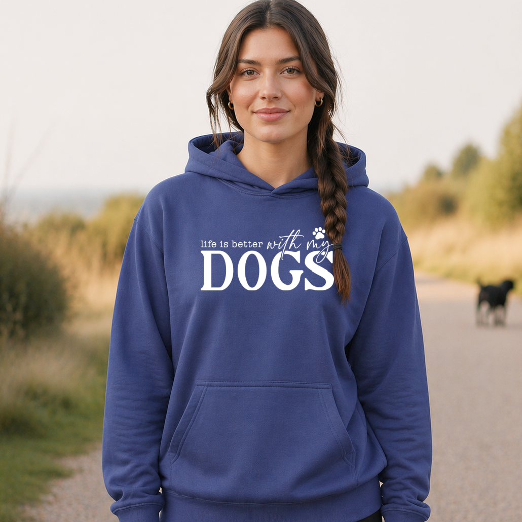 Woman wearing a blue hoodie with 'life is better with my DOGS' text, standing outdoors.